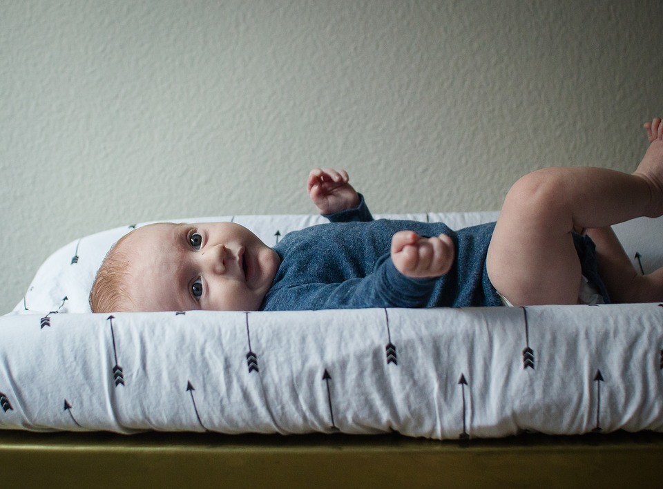 baby on changing pad