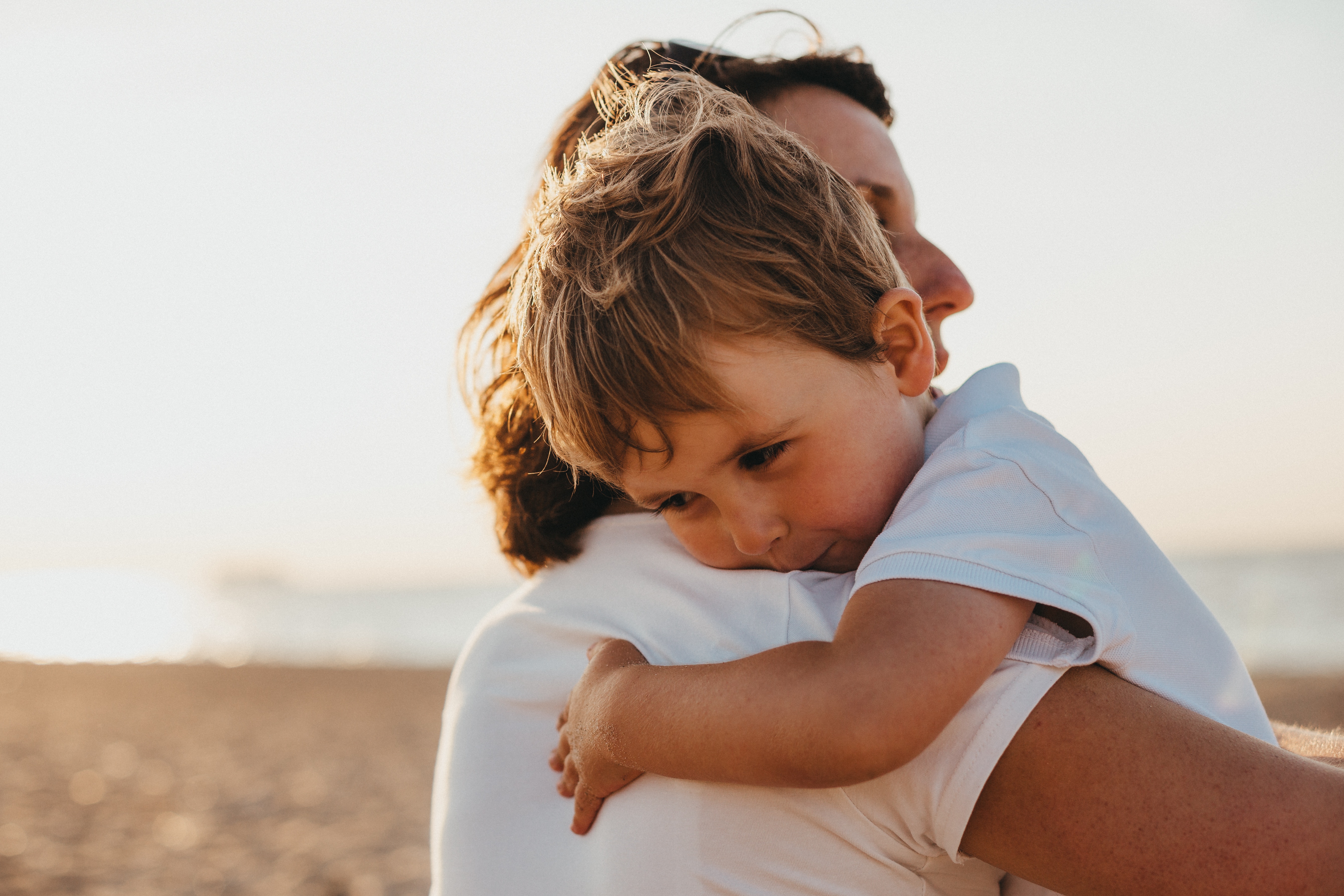 child hugging adult