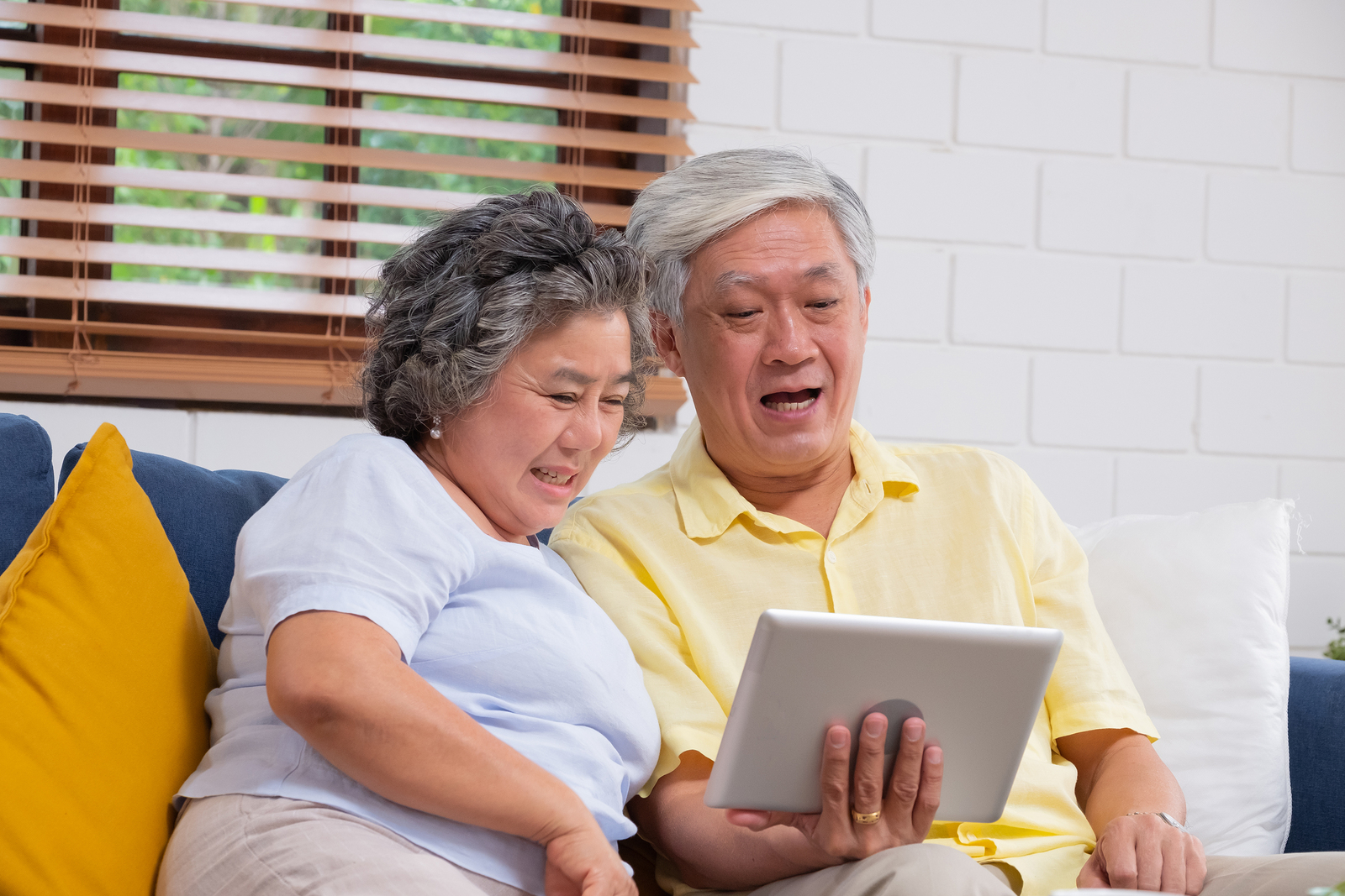 grandparents using tablet device