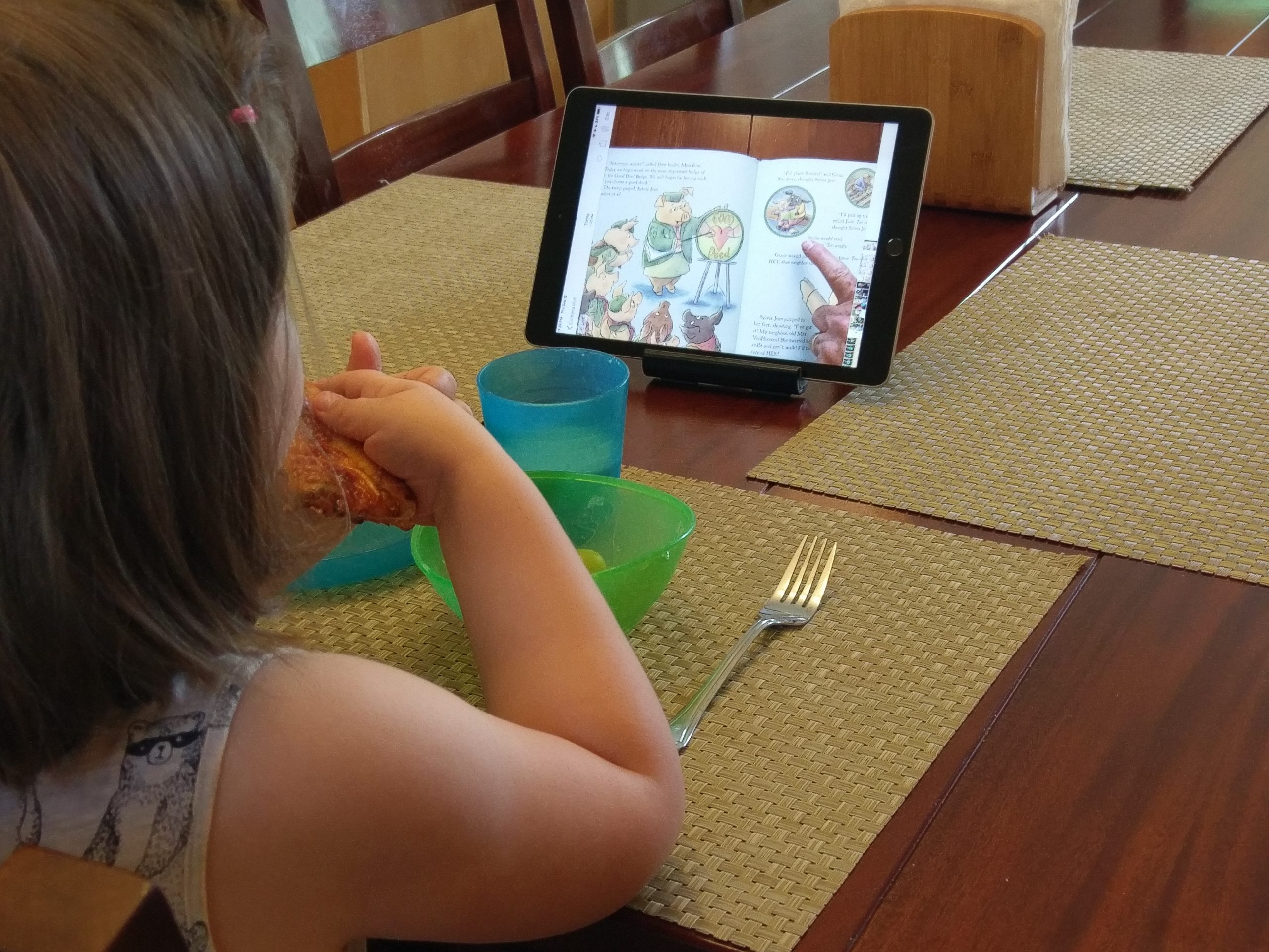 Child watching iPad at Breakfast