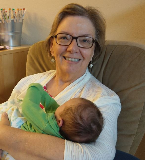 Gram holding baby